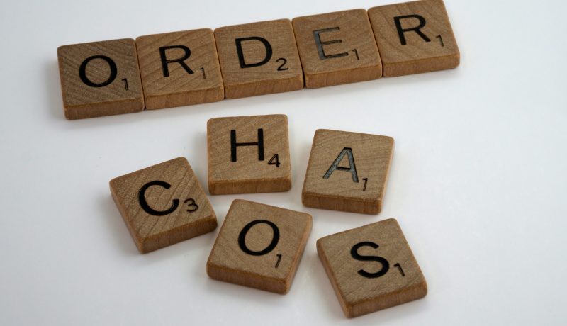 Thriving in Chaos: Understanding Distraction, Disorder, and the Modern Mind A picture with the words Order and Chaos