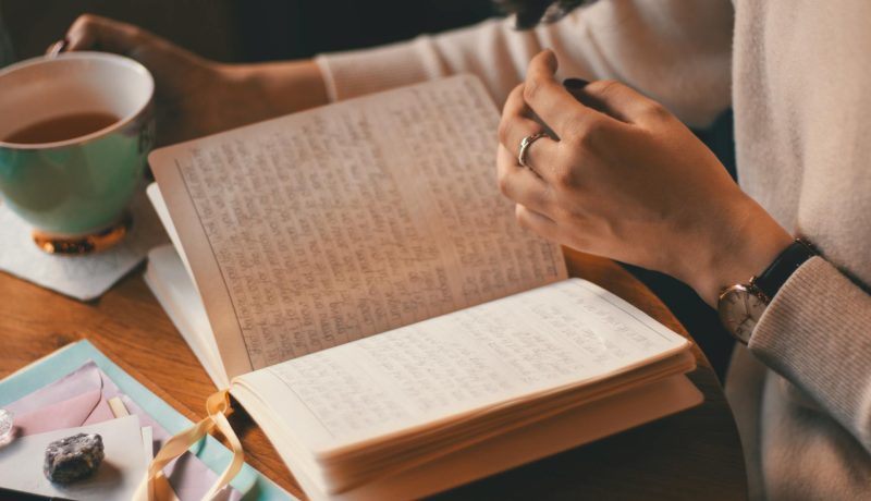 Benefits of Self Reflection for Personal Development A woman reading through her journal
