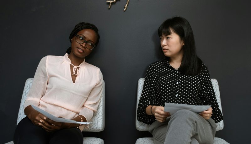 The Goldilocks Rule: How to stay motivated in Life and Work. Two women sitting in an office.