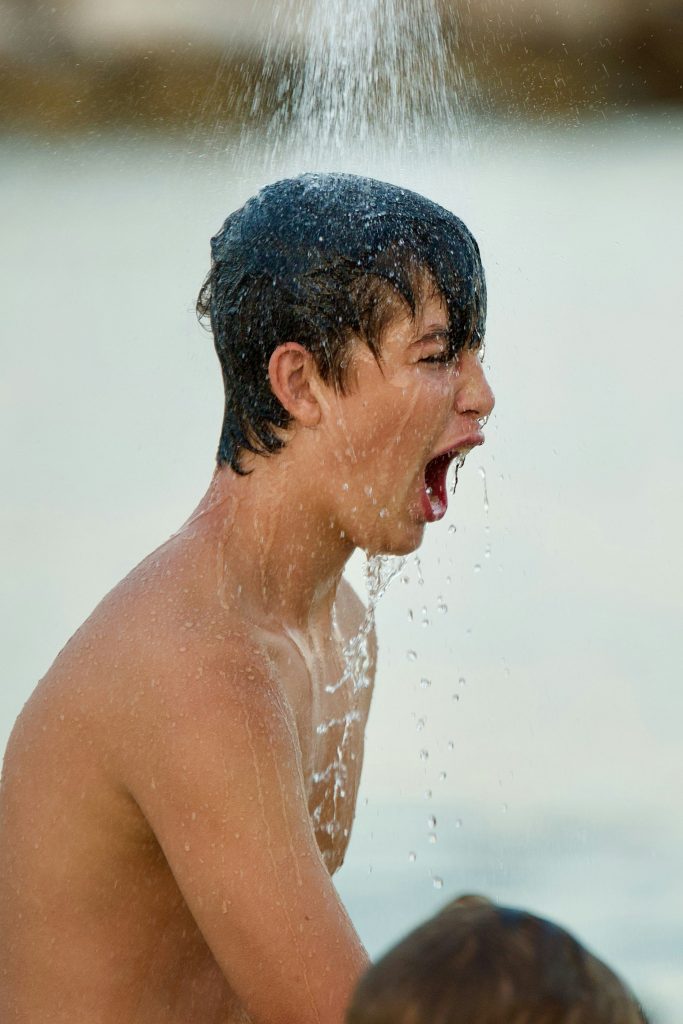 A man taking a cold shower