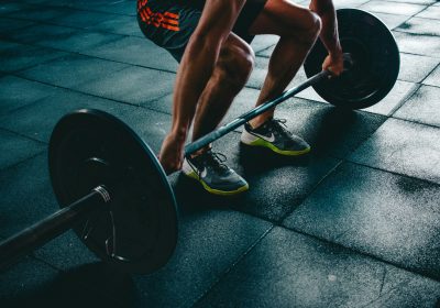A man in a gym lifting weights