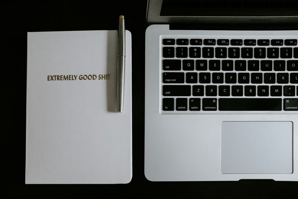 A laptop and a notebook