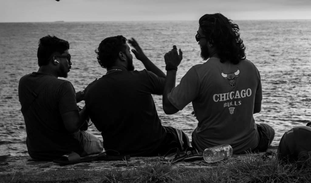 Three males at the beach side